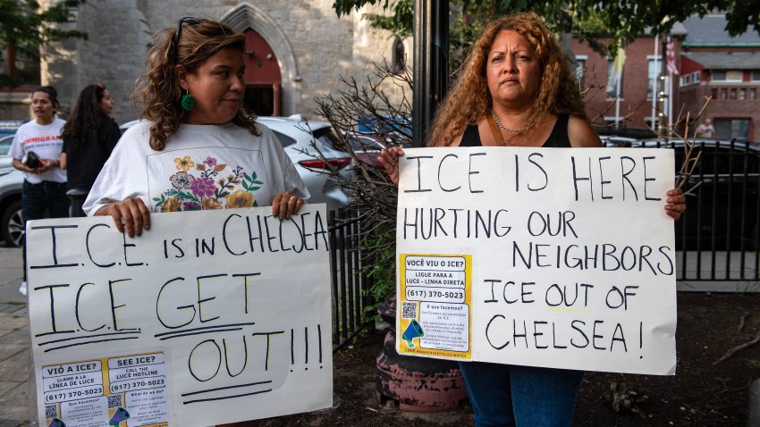 Community members gather and hold signs during a vigil to call for the release of Cata Xochitl Santiago and Carlos Chang and others detained by US Immigration and Customs Enforcement (ICE) in Boston, Massachusetts, on August 24, 2025. US President Donald Trump, who campaigned on a pledge to deport large numbers of migrants, has encouraged authorities to be more aggressive as he seeks to hit his widely reported target of one million deportations annually. (Photo by Joseph Prezioso / AFP) (Photo by JOSEPH PREZIOSO/AFP via Getty Images)