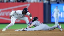 Sep 30, 2025; Bronx, New York, USA; Boston Red Sox shortstop Trevor Story (10) steals second base ahead of the tag of New York Yankees second baseman Jazz Chisholm Jr. (13) during the ninth inning of game one of the Wildcard round of the 2025 MLB playoffs at Yankee Stadium. Mandatory Credit: Brad Penner-Imagn Images