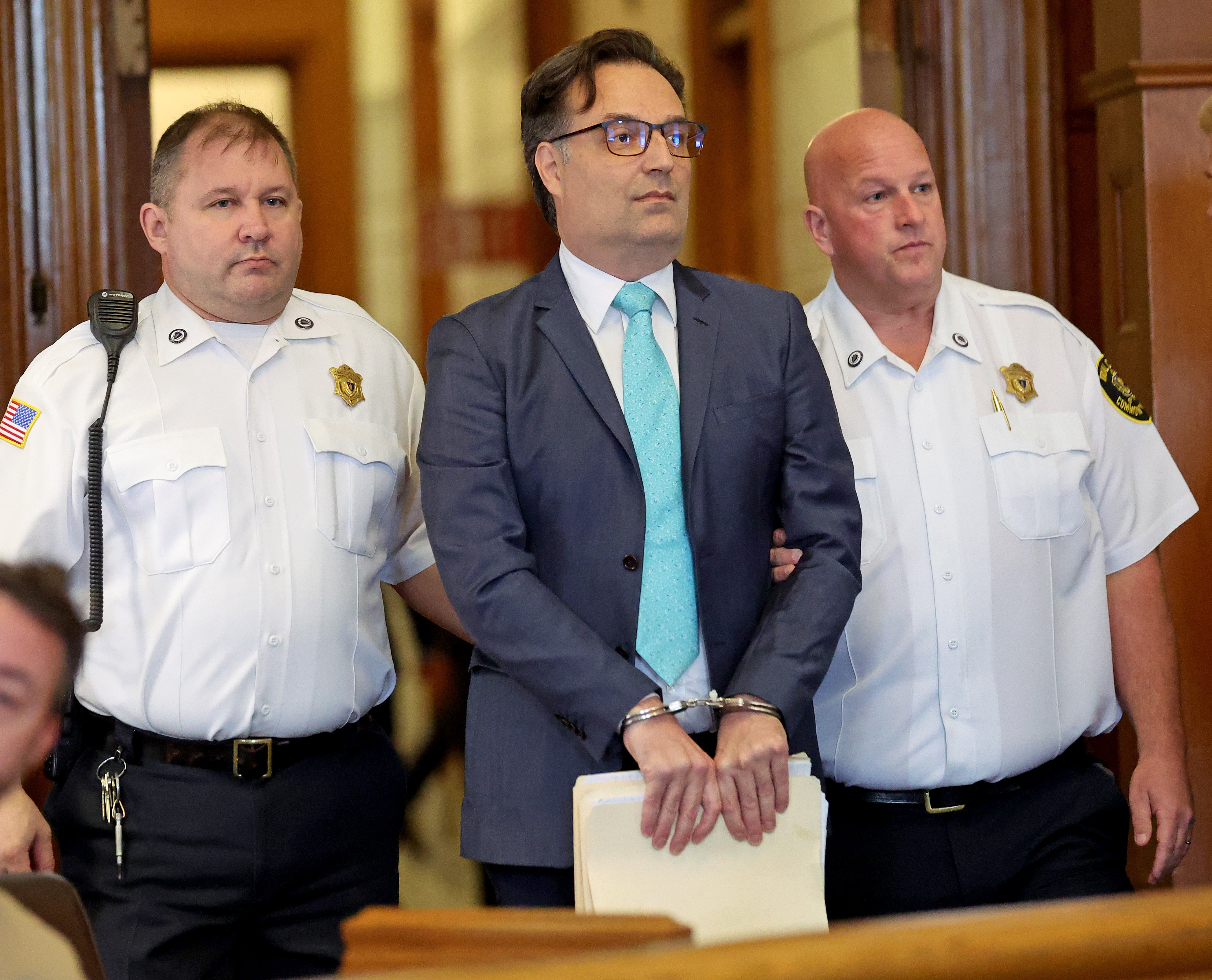 Dedham, MA – October 2: Brian Walshe, accused of murdering wife Ana Walshe on Jan. 1, 2023, is lead into his hearing at Norfolk Superior Court.   (Photo by Matt Stone/MediaNews Group/Boston Herald via Getty Images)