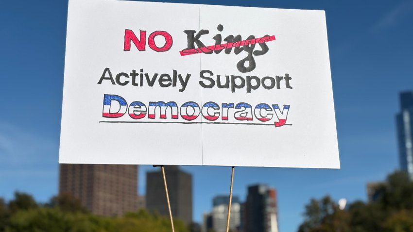 A sign that reads "No Kings, Actively Support Democracy," at the Boston Common "No Kings" protest on Saturday, Oct. 18, 2025.