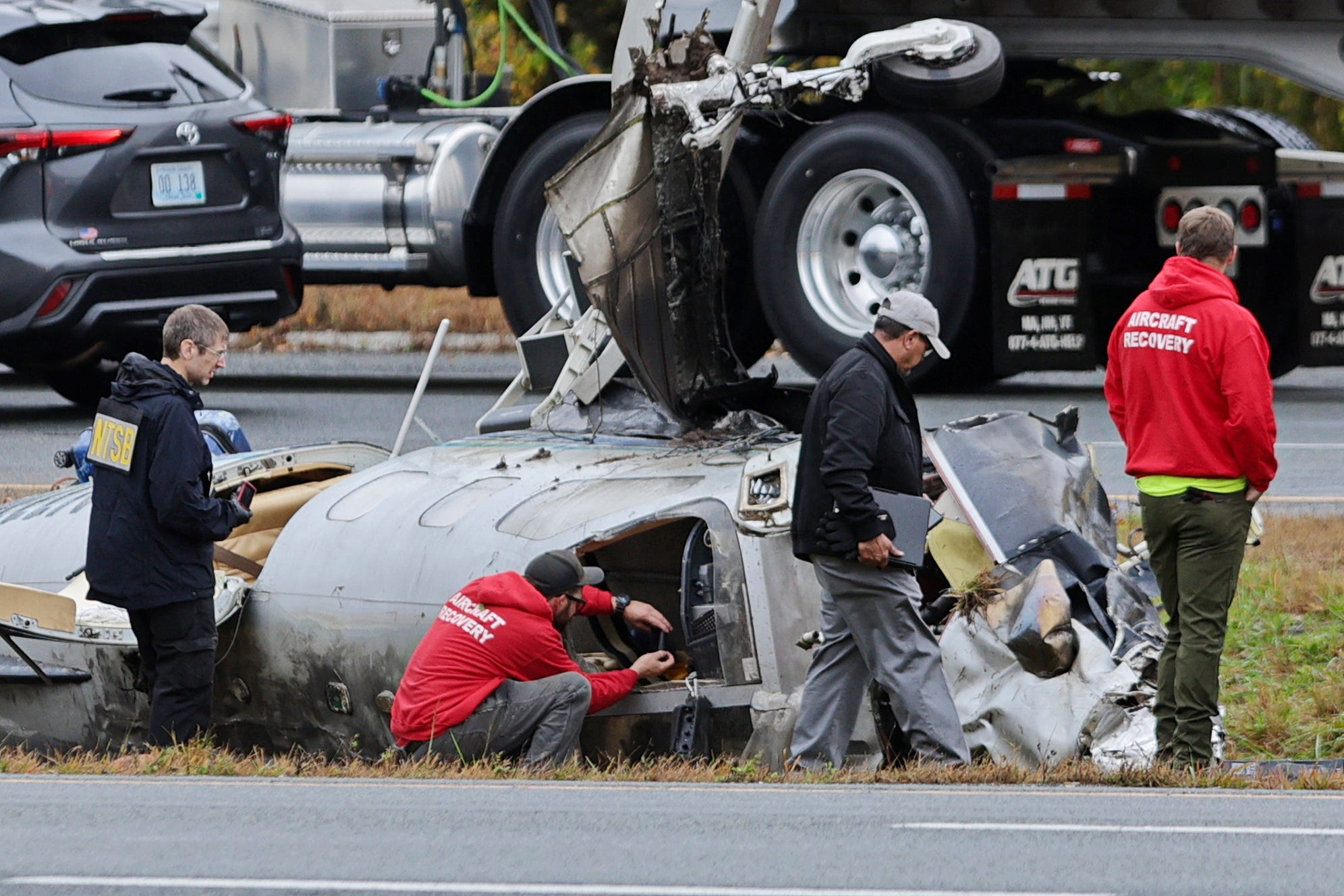 NTSB officials document the fuselage of the fatal plane crash on I-195 in Dartmouth.