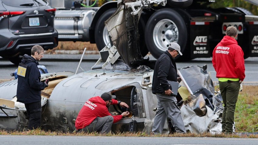 NTSB officials document the fuselage of the fatal plane crash on I-195 in Dartmouth.
