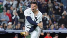 Oct 1, 2025; Bronx, New York, USA; New York Yankees relief pitcher Fernando Cruz (63) celebrates a bases loaded fly out to end the seventh inning against the Boston Red Sox during game two of the Wildcard round for the 2025 MLB playoffs at Yankee Stadium. Mandatory Credit: Brad Penner-Imagn Images