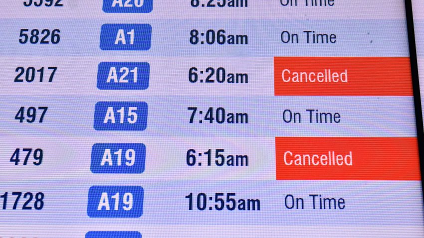 Multiple cancelled flights are displayed on a departures board at Boston Logan International Airport in Boston, Massachusetts on November 10, 2025. The US Senate took a major step on November 9 toward ending the longest government shutdown in American history when it cleared the way for a formal debate on a motion to resume funding to federal agencies. The deal between Democratic and Republican senators, just the first step to halting the shutdown, came as authorities warned US air travel could soon “slow to a trickle” as thousands more flights were cancelled or delayed over the weekend. (Photo by Joseph Prezioso / AFP) (Photo by JOSEPH PREZIOSO/AFP via Getty Images)