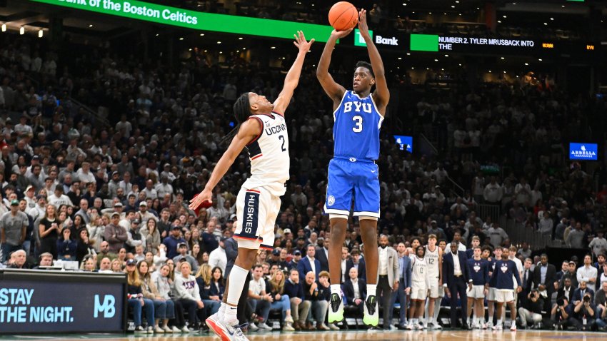 Nov 15, 2025; Boston, Massachusetts, USA; BYU Cougars forward AJ Dybantsa (3) shoots the ball over .UConn Huskies guard Silas Demary Jr. (2) during the second half at TD Garden. Mandatory Credit: Eric Canha-Imagn Images