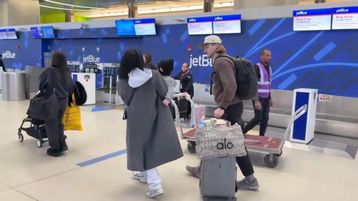 Some Patriots fans happy to miss storm for AFC Championship in Denver