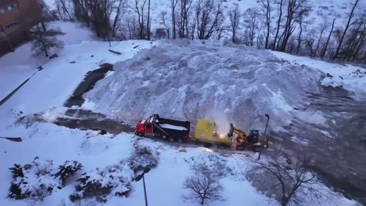 Snow piling up at Boston's ‘snow farms' as students return to school in city