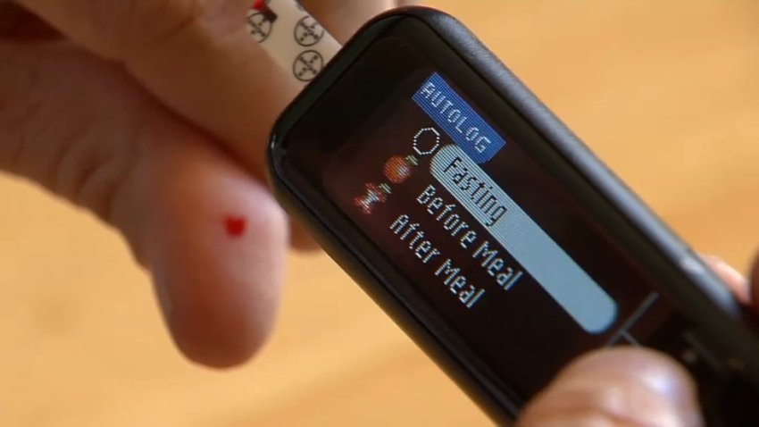 A blood glucose monitor helps test blood sugar.