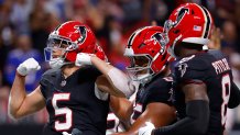 Drake London celebrates with teammates