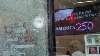 Shattered windows were seen at a gift shop on Pennsylvania Avenue the morning after a man opened fire near the White House.