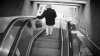 Man caught in MBTA escalator died from brain injuries tied to strangulation