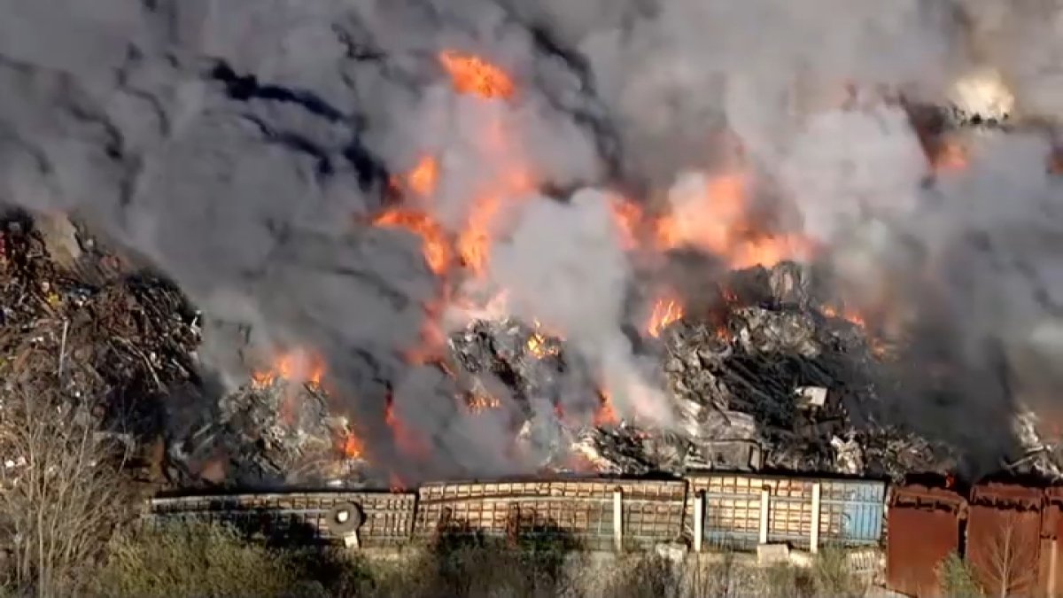 Firefighters continue to monitor Westport scrap yard fire into second day