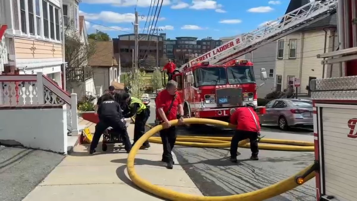 Woman injured after jumping from 2nd story of burning building in Everett