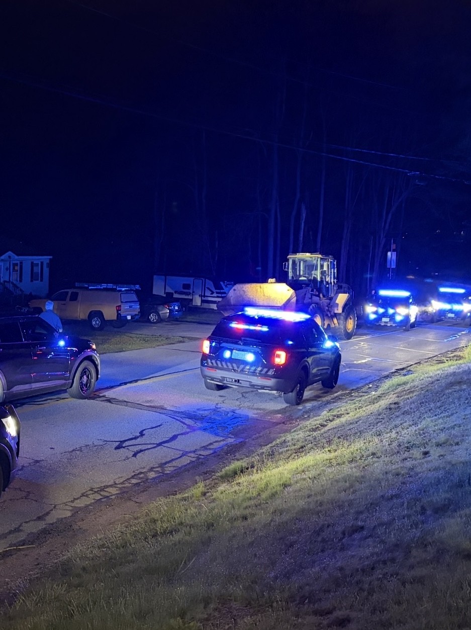 Police chase slow-moving construction vehicle through Mass. town before arrest