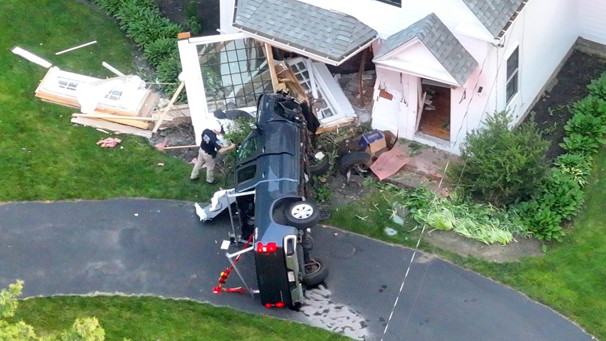 Driver dies after pickup truck smashes into Hanson home