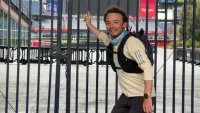 Danny Gorelik at a Gillette Stadium gate after running to the World Cup venue from Boston.