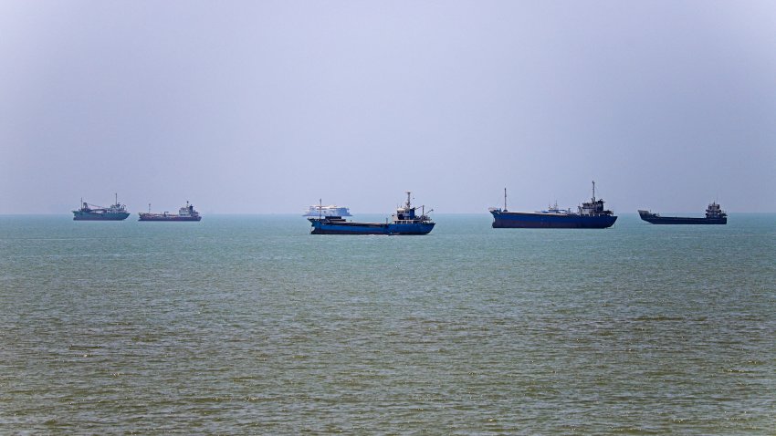 TOPSHOT &ndash; In this picture obtained from Iran&rsquo;s ISNA news agency on June 18, 2026, vessels are seen anchored in Bandar Abbas along the Strait of Hormuz. Oil prices tumbled after Trump and his Iranian counterpart separately signed their accord to end the Middle East war, with the Strait of Hormuz to reopen but two months of negotiations lying ahead.