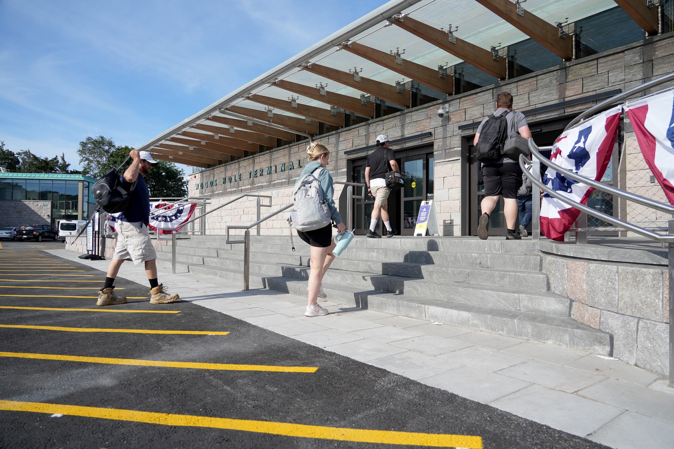 Passengers from the shuttle bus head into the Steamship Authority's new Woods Hole ferry terminal as it opened to the public on Thursday, June 25, 2026.