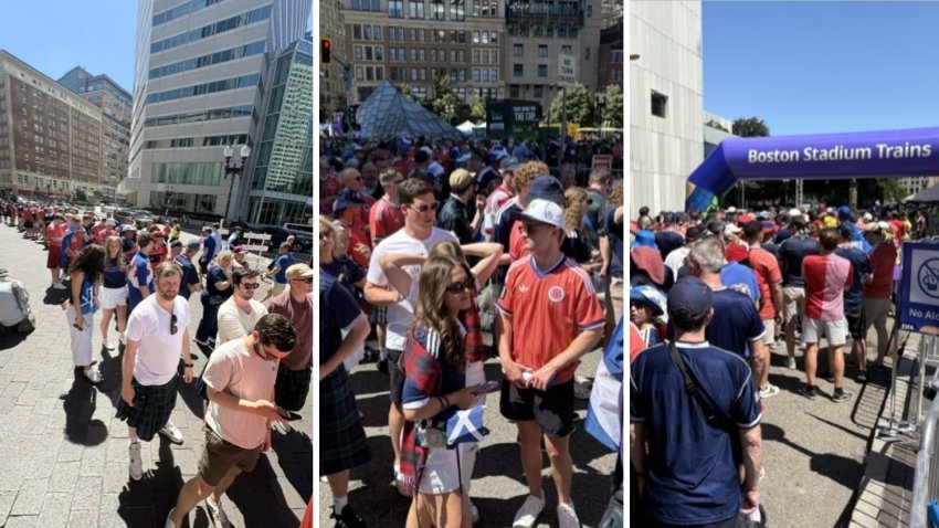 Fans waiting in line outside South Station for the MBTA train to Boston Stadium.
