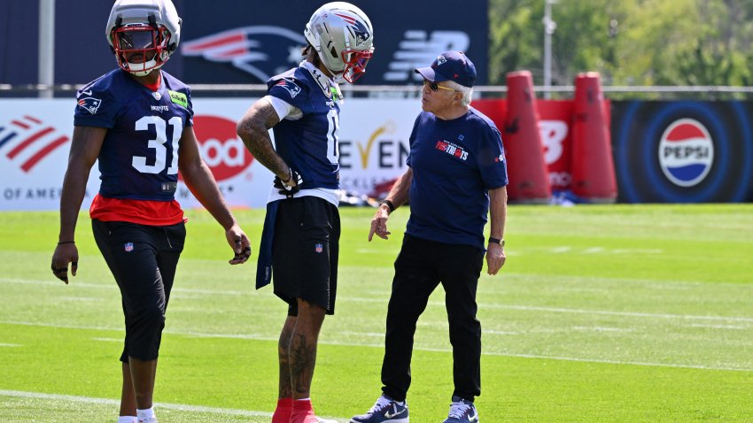 Jul 25, 2026; Foxborough, MA, USA; New England Patriots owner Robert Kraft speaks to New England Patriots cornerback Christian Gonzalez (0) at training camp at Gillette Stadium. Mandatory Credit: Eric Canha-Imagn Images