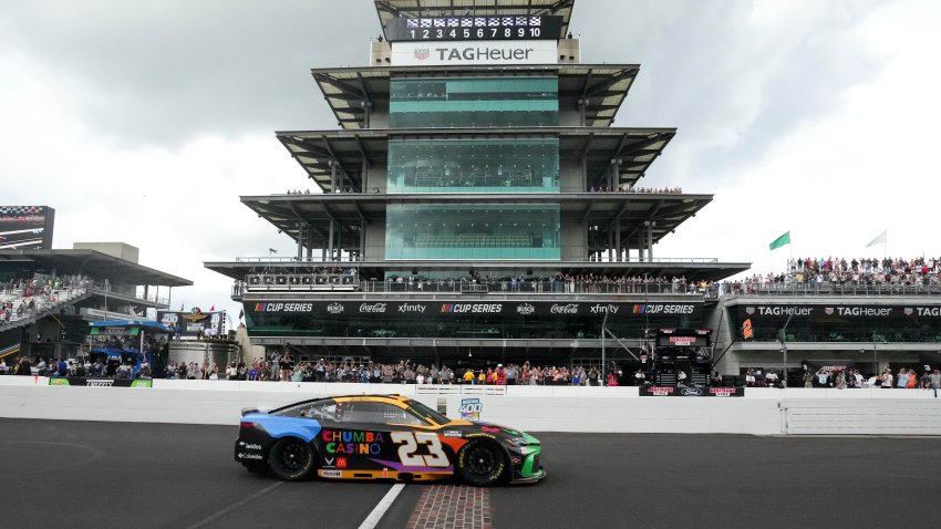 Bubba Wallace (23) crosses the yard of bricks