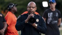 Seattle Police Chief Shon Barnes speaks during a vigil.