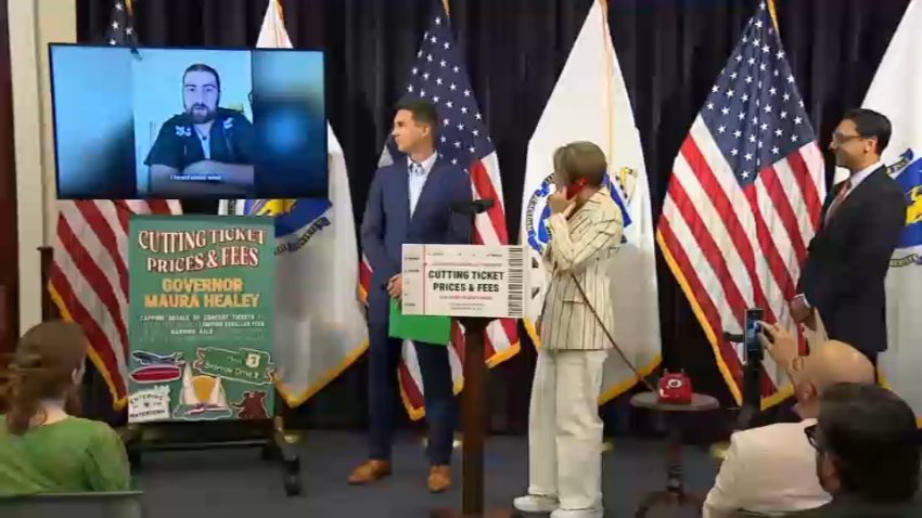 Gov. Maura Healey at the Massachusetts State House, watching a video message from Noah Kahan, as she announces plan to cut ticket resale prices and fees.