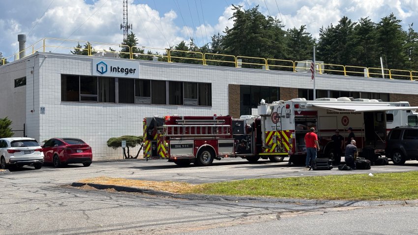 Fire trucks outside a business from which 16 people were sent to hospitals on Thursday, Aug. 13, 2026.