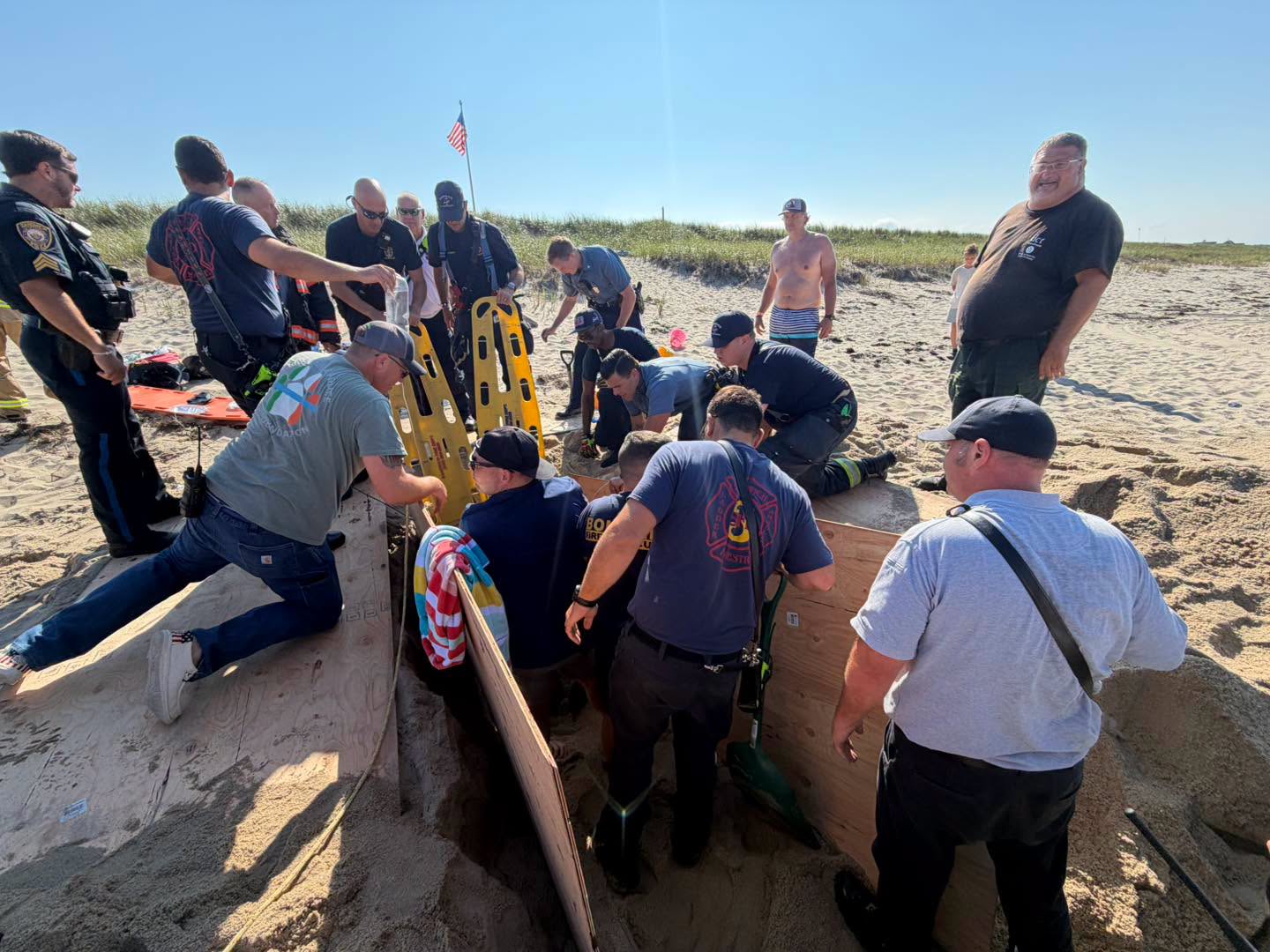 First responders pull partially buried beachgoer from sand on Cape Cod