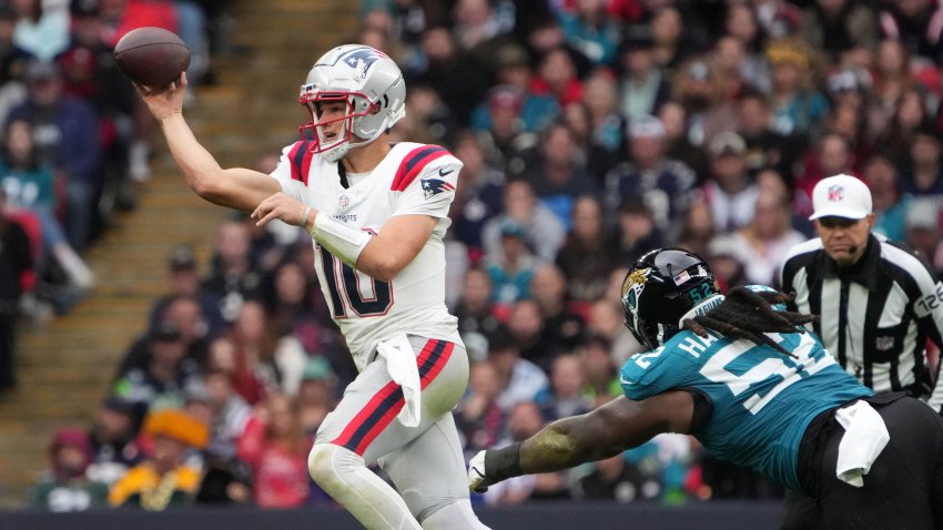 New England Patriots quarterback Drake Maye (10) throws the ball against Jacksonville Jaguars defensive tackle DaVon Hamilton (52)