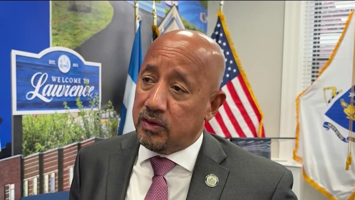 Lawrence mayor says he won't resign after being charged in federal, state courts