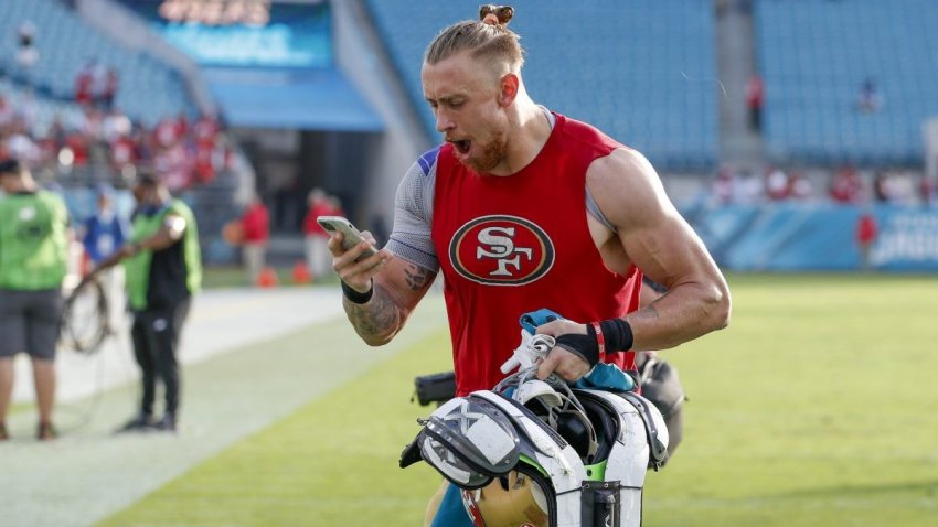 JACKSONVILLE, FL – NOVEMBER 21: San Francisco 49ers tight end George Kittle (85) talks into a phone following the game between the San Francisco 49ers and the Jacksonville Jaguars on November 21, 2021 at TIAA Bank Field in Jacksonville, Fl. (Photo by David Rosenblum/Icon Sportswire via Getty Images)
