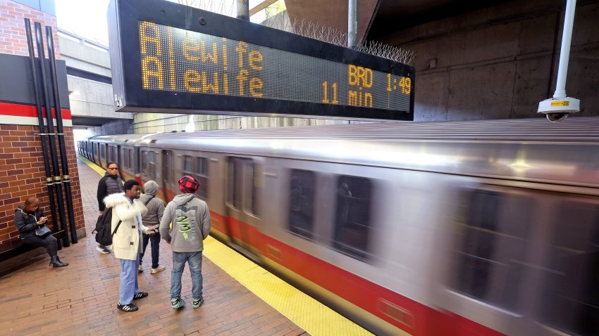 Boston, MA – November 24 – A Red Line MBTA train rushes past passengers at Quincy Adams train station.  (Photo By Matt Stone/MediaNews Group/Boston Herald via Getty Images).