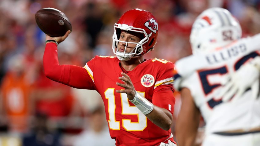Patrick Mahomes #15 of the Kansas City Chiefs throws a pass against the Denver Broncos.