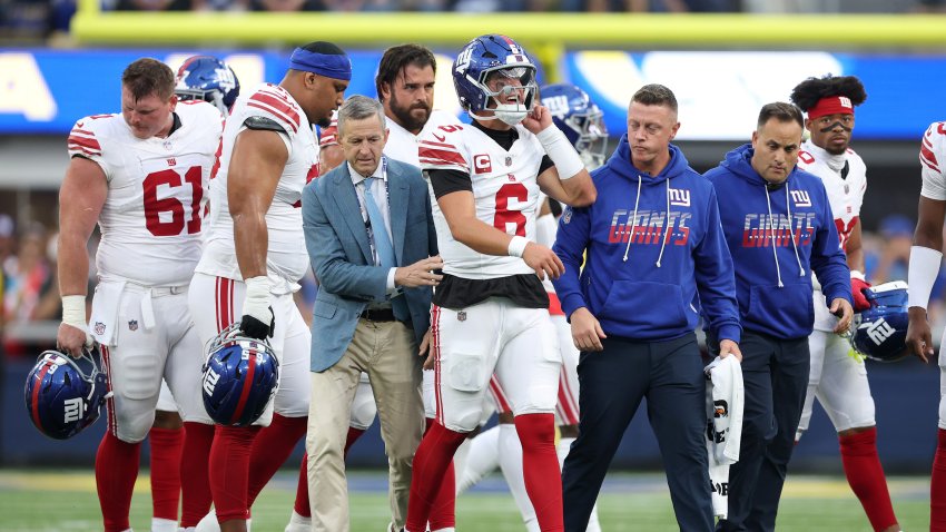 Jaxson Dart #6 of the New York Giants walks off the field.