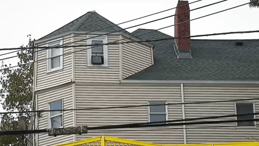 A multifamily home in Malden, Mass., where a woman was held for six weeks in the unfinished attic after being kidnapped and sexually trafficked.
