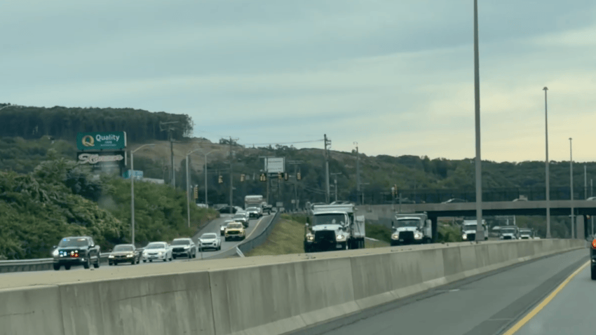 CT DOT trucks form procession to honor worker who was struck and killed on I-95 Friday morning in Fairfield.