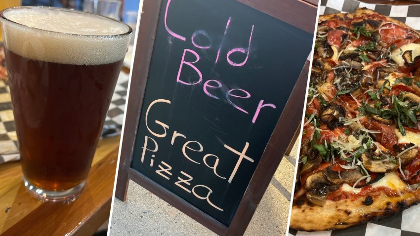 Beer, pizza and a sign advertising both at Black Cloud Brewing Co. in Keene, New Hampshire.