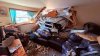 Truck slams into Fall River home, pinning person under vehicle; 2 others hurt