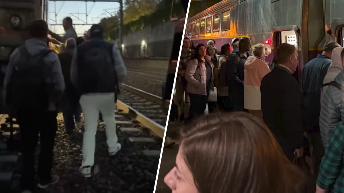 MBTA Commuter Rail riders stranded on dark train before walking along tracks
