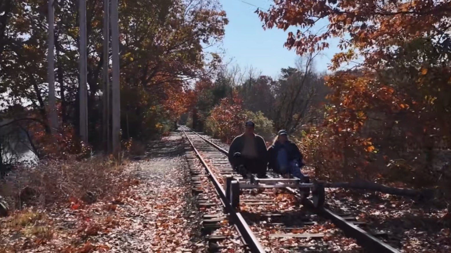 People on a rail bike from Concord, New Hampshire's, Scenic RailRiders.