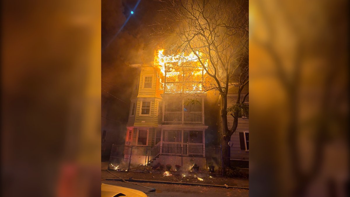 Heavy fire in Lawrence burns through third floor of building